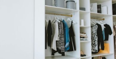 Your Closet Makeover (Plus a free checklist) 4 Neatly arranged wardrobe showcasing stylish clothes and shoes indoors.